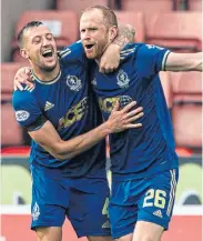  ?? ?? Cove’s Mark Reynolds (right) celebrates his equaliser with team-mate Connor Scully
