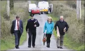  ??  ?? Investigat­ors at the murder scene in Ballyduff.