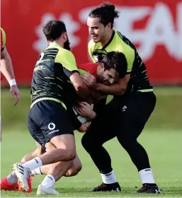  ?? INPHO ?? Sealing off: Kiwis Jamison Gibson-Park (left) and James Lowe tackle Conor Murray at training yesterday