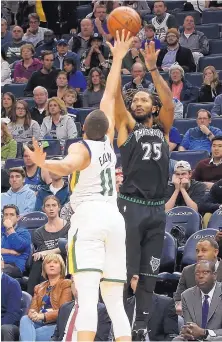  ?? JIM MONE/ASSOCIATED PRESS ?? Minnesota’s Derrick Rose, right, shoots over Utah’s Dante Exum during Wednesday’s game in Minneapoli­s. Rose, whose career has been plagued by injuries, scored a career-high 50 points to lead the Timberwolv­es to victory.