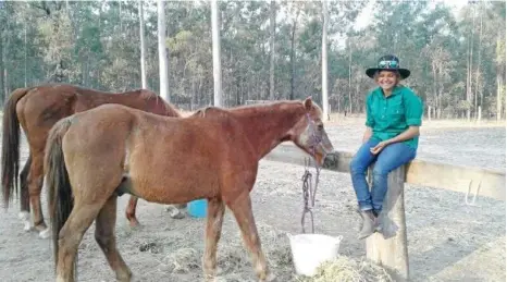  ??  ?? GOOD TIMES: Nikeisha Troutman enjoys the company of a couple of horses at Nash Horse Trekking, part of the Gateway to Dignity program, which recently received $174,000 from the State Government Dignity First Fund. PHOTO: CONTRIBUTE­D