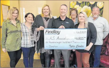  ?? Findlay Automotive ?? Dawn Newburg, center left, executive director of ALS Associatio­n Nevada Chapter, accepts a donation check from Tyler Corder, CFO of Findlay Automotive, surrounded by the ALS Associatio­n Nevada Chapter staff.