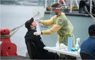  ?? RYAN TAPLIN • THE CHRONICLE HERALD ?? A sailor from HMCS Halifax gets a PCR test at CFB Halifax on Monday. Since the ship’s return from a six-month mission in Europe, two members of the crew have tested positive for COVID-19 and are now required to isolate at CFB Halifax for 14 days.