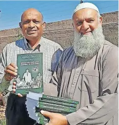  ?? Supplied ?? PREMA Naidoo with author Ismail Vadi at the launch of the book in Lenasia last month. Naidoo is the son of Roy Naidoo and Manonmoney ‘Ama’ Naidoo, grandson of Thambi Naidoo, and brother of Shanthie, Indres, and Murthie Naidoo. |