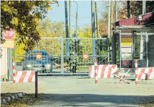  ??  ?? Armed soldier checks traffic at a security gate in the ‘closed’ town in remote Russia