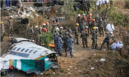  ?? ?? Rescuers inspect the site of the Yeti Airlines plane crash in Nepal. Photograph: Skanda Gautam/SOPA Images/REX/Shuttersto­ck