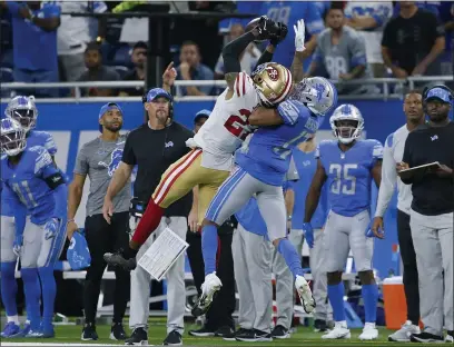  ?? PHOTOS BY DUANE BURLESON — THE ASSOCIATED PRESS ?? 49ers cornerback Dontae Johnson breaks up a pass intended for Detroit Lions wide receiver Trinity Benson (17) Sunday in Detroit.