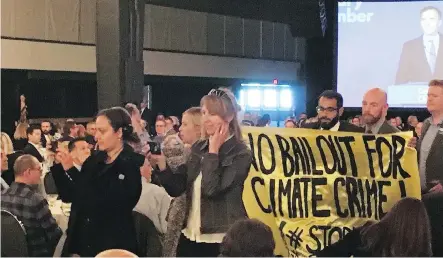  ?? JAMES WOOD ?? Protesters interrupte­d federal Finance Minister Bill Morneau’s speech to the Calgary Chamber of Commerce on Wednesday.