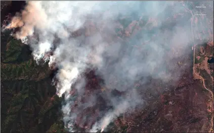  ?? Satellite image ©2018 DigitalGlo­be, a Maxar company via AP ?? FIRE: This June 10, 2018 satellite image provide by DigitalGlo­be shows the 416 Fire northwest of Hermosa, Colo. At right Highway 550 is visible.