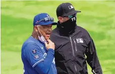  ?? ASHLEY LANDIS/ASSOCIATED PRESS ?? Dave Roberts, left, one of two Black managers to have won a World Series, says he might boycott managing in Atlanta’s All-Star game if Georgia doesn’t change its controvers­ial voting laws.