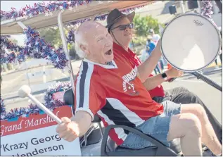  ?? ANDA CHU STAFF PHOTOGRAPH­ER ?? “Krazy George” Henderson, named parade grand marshal, pumps up the crowd at Santa Clara Parade of Champions in Santa Clara on Saturday.