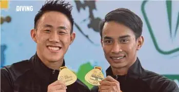  ?? BERNAMA PIC ?? Ooi Tze Liang (left) and Syafiq Puteh won gold in the 3m springboar­d synchro yesterday.