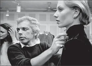  ?? The Washington Post/JOHN MCDONNELL ?? Ralph Lauren preps a model in his showroom for a photo shoot during Fashion Week in March 1980.