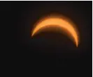  ??  ?? A view of Monday’s partial solar eclipse, as seen from Adler Planetariu­m’s Eclipse Fest.