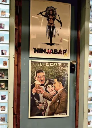  ?? Yomiuri Shimbun photos ?? Old-fashioned posters hang on a door.
