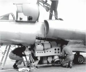  ??  ?? The only weapon the Dragon Lady carried was the state-of-the-art A-2 camera. It provided crystal clear imagery for the intelligen­ce people. This A-2 unit is being winched up into the camera bay after some maintenanc­e work. (Photo courtesy of Denny Lombard via Warren Thompson.)