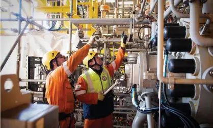  ?? Photograph: Andy Buchanan/AFP/Getty Images ?? Workers on an oil platform in the North Sea, east of Aberdeen.