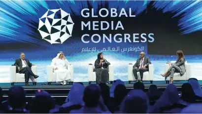  ?? — WAM ?? Mona Al Marri (centre) with other experts and dignitarie­s in a panel discussion at the Global Media Congress in Abu Dhabi on Wednesday.