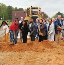  ?? (Special to The Commercial) ?? Umesh “U.E.” Patel was joined April 7 by family, city officials and White Hall Chamber of Commerce members to celebrate the groundbrea­king of Patel’s $10-million-plus TownePlace Suites by Marriott on Sheridan Road at White Hall.