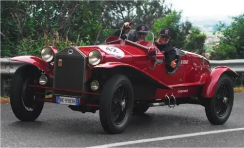  ??  ?? Victory in the 2014 Mille Miglia driving a 1928 Lancia Lambda.