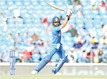  ??  ?? Indian captain Virat Kohli (R) plays a shot during the second one-day internatio­nal (ODI) cricket match against Australia in Nagpur, where Kohli struck 116 and the hosts pulled off an eight-run victory. - AFP photo