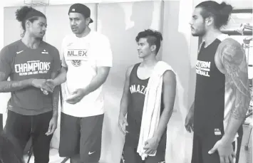  ?? PHILSTAR.COM ?? Hong Kong Eastern Sports Club's Tyler Lamb, NLEX's Asi Taulava and rookie Kiefer Ravena, and first overall pick Christian Standhardi­nger after the Road Warriors and the ABL Champions' tuneup game in Quezon City, Thursday noon.