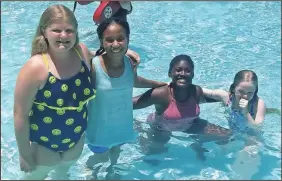  ?? CONTRIBUTE­D PHOTO ?? Gordon County 4- H’ers Ava, Gabriella, Raniyah, and Ella enjoying the swimming pool at Rock Eagle.