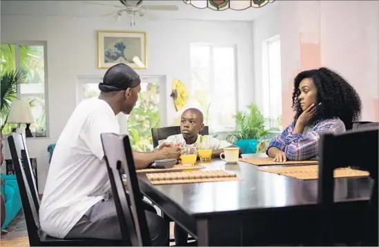  ?? David Bornfriend A24 ?? A PIVOTAL SCENE in Barry Jenkins’ film “Moonlight” brings together Juan (Mahershala Ali, left), Little (Alex R. Hibbert) and Teresa (Janelle Monáe).