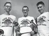  ?? DISPATCH FILE PHOTO ?? Ohio State Marching Band trumpet players (L to R) Tom Larimer, Harold Bingham and Wilbur Garland model their new sweatshirt­s at the 1955 Rose Bowl.