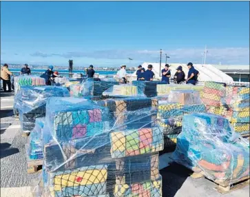  ?? Karen Kucher San Diego Union-Tribune ?? COCAINE seized off the coasts of Central and South America sits Thursday on the deck of the Coast Guard cutter Stratton at a San Diego pier. Some of the cocaine was located with drone surveillan­ce.
