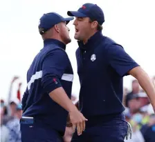  ?? GETTY IMAGES ?? COMING THROUGH: Bryson DeChambeau, left, and Scottie Scheffler of the U.S. celebrate on the 15th green during Saturday afternoon fourball matches of the 43rd Ryder Cup at Whistling Straits in Kohler, Wisc.