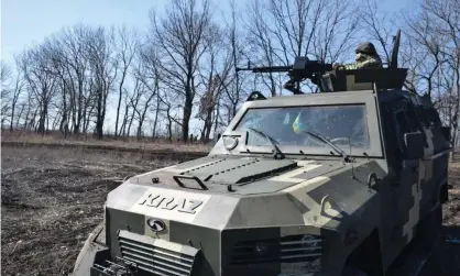  ??  ?? Ukrainian armed forces patrol the border after tension in the region following the death of an Ukrainian soldier by pro-Russian separatist­s. Photograph: Anadolu Agency/Getty Images