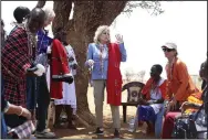  ?? (AP/Brian Inganga) ?? U.S. first lady Jill Biden (center) greets women of the Maasai community Sunday as they explain the drought situation in Ngatataek, Kenya.