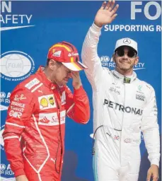  ?? FOTO: DPA ?? Sebastian Vettel (li.) musste Lewis Hamiltons Sieg anerkennen.