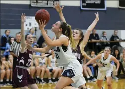  ?? AUSTIN HERTZOG - MEDIANEWS GROUP ?? Villa Maria’s Maddy Ryan looks to the rim as she gets by the defense of Pottsgrove’s Sydney Mowery.
