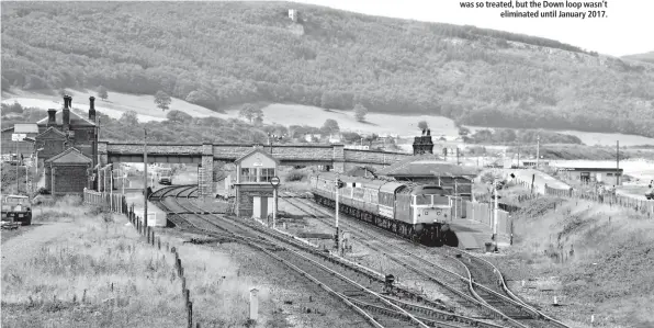  ??  ?? This August 13 1985 view shows 47475 leaving Abergele with the 1114 Bangor-Newcastle. The white pegs show the projected realignmen­ts of the Up and Down main lines to serve the platforms. In 1988, the line on which the train is travelling was so...