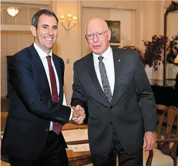  ?? ?? Tough mission: Chalmers (left) shakes hands with governor general David Hurley after taking his oath. He admits that there are significan­t challenges as he tries pushing the
national debt down. — AFP