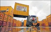  ?? REUTERS ?? A forklift operator stacks containers at the godown of Agarwal Packers and Movers Ltd. on the outskirts of Mumbai.