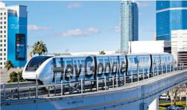  ?? THE ASSOCIATED PRESS ?? A monorail with a Google advertisem­ent passes the Las Vegas Convention Center during CES Internatio­nal Wednesday in Las Vegas.