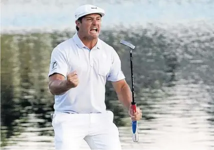  ?? JOHN RAOUX/AP ?? Bryson DeChambeau celebrates after sinking a putt to win the Arnold Palmer Invitation­al golf tournament Sunday at Bay Hill.