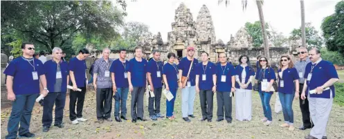  ??  ?? Culture Minister Vira Rojpojchan­arat, seventh right, with diplomats and senior culture officials at the Sdok Kok Thom temple in Sa Kaeo province.