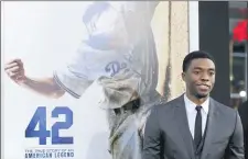  ?? PHOTO BY CHRIS PIZZELLO/INVISION/AP, FILE ?? In this 2013 file photo, Chadwick Boseman, who plays baseball legend Jackie Robinson in “42,” poses at the Los Angeles premiere of the film at the TCL Chinese Theater in Los Angeles.