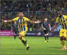  ??  ?? Pahang player Mohamad Faisal Abdul Halim (left) celebrates his score against Terengganu FC at Darul Makmur Stadium. — Bernama photo