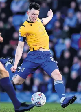  ??  ?? Rovers midfielder Ollie Clarke gets a shot away against Wycombe