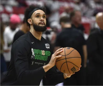  ?? MICHAEL LAUGHLIN — THE ASSOCIATED PRESS ?? Boston Celtics guard Derrick White warms up before the start of Game 6 of the NBA basketball Eastern Conference finals against the Miami Heat, Saturday, May 27, 2023, in Miami.