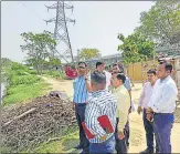  ?? SOURCED ?? Greater Noida authority’s CEO Narendra Bhooshan and other officials inspecting an area in Kasna village on Friday.