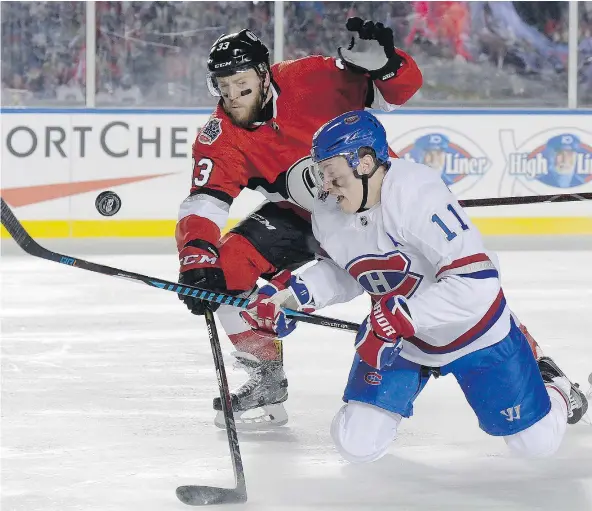  ?? — THE CANADIAN PRESS FILES ?? Canadiens winger Brendan Gallagher, right, vies for control of the puck with Senators defenceman Fredrik Claesson during Saturday’s NHL 100 Classic outdoors in Ottawa on Saturday. Gallagher has been a rare bright spot for the Habs this season.