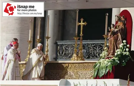  ??  ?? Solemn ceremony: Benedict incensing the altar as he celebrates the canonisati­on ceremony in St Peter’s Square at the Vatican. — AP