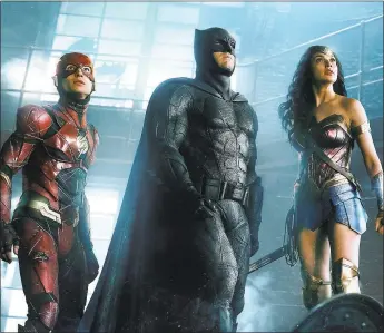  ?? WARNER BROS. ENTERTAINM­ENT ?? Ezra Miller, left, Ben Affleck and Gal Gadot in “Justice League.”