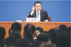  ??  ?? China’s Premier Li Keqiang gestures during a news conference after the closing ceremony of China’s National People’s Congress at the Great Hall of the People in Beijing, China. — Reuters photo